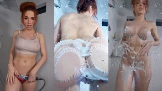 Amouranth in the shower leans her butt against the glass